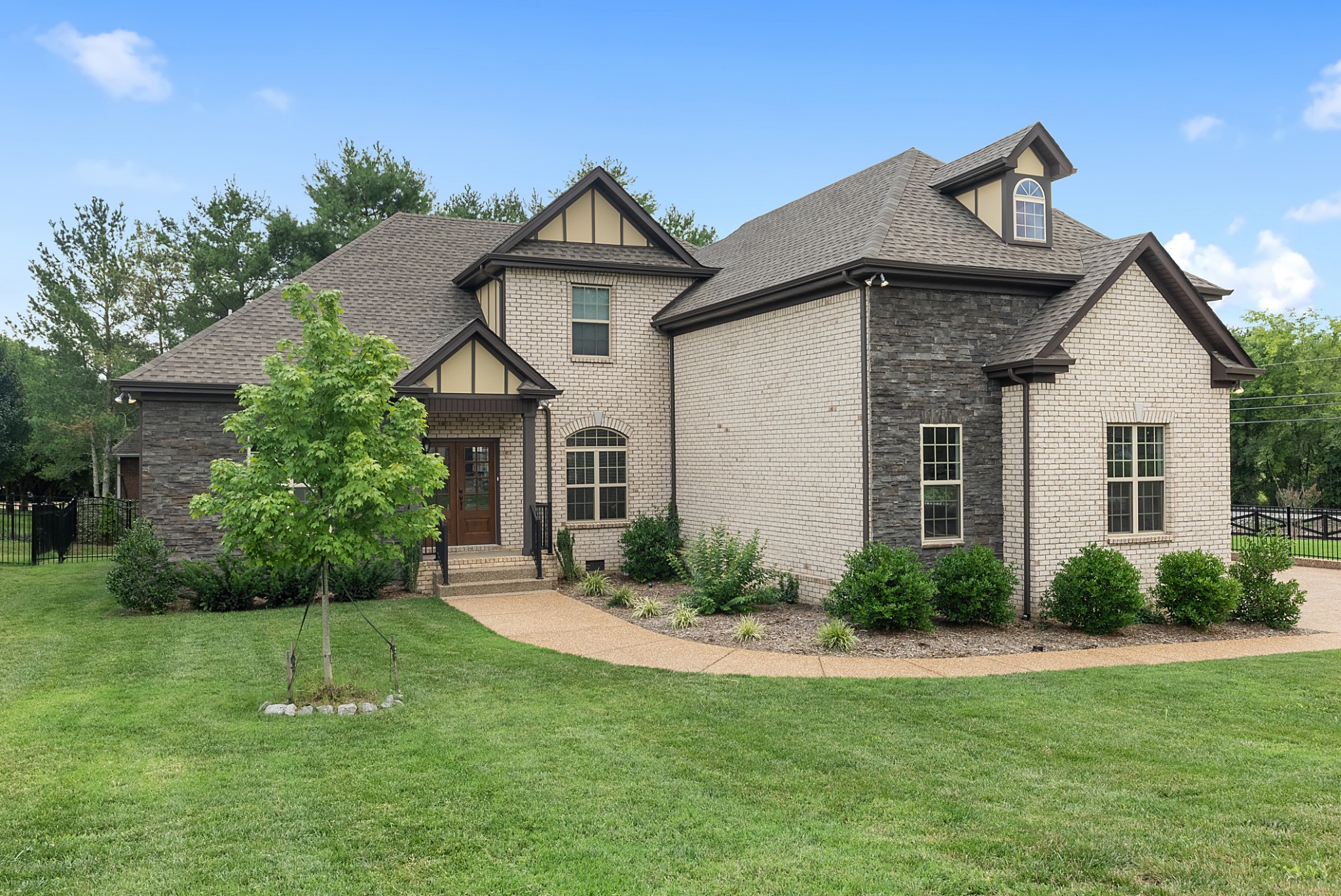 a front view of a house with a yard
