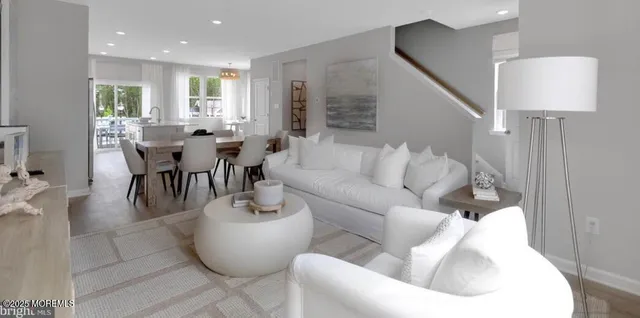 a living room with furniture and flat screen tv