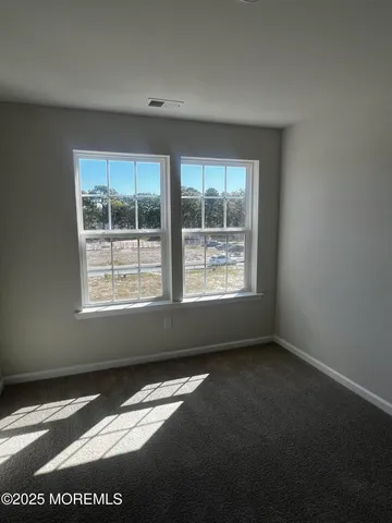 a bedroom with a bed and a lamp