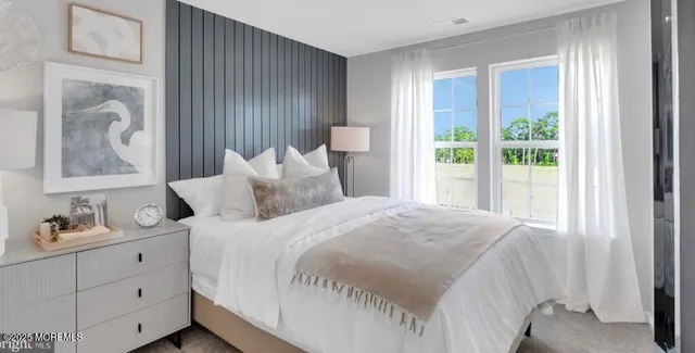 a large white bed in a white room