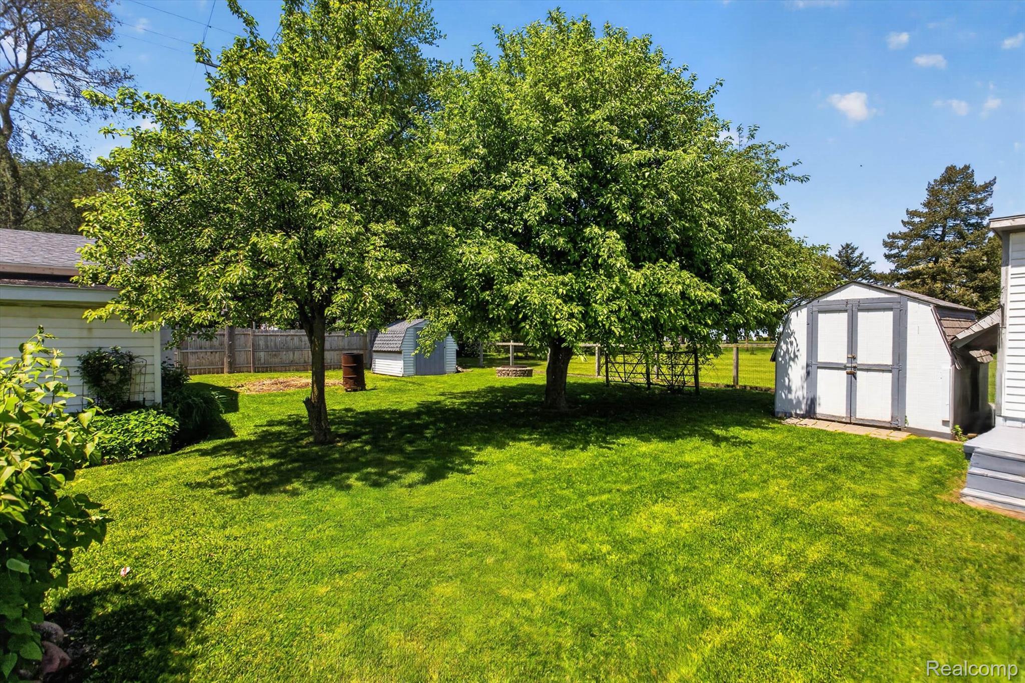 7974 West Gilford Road Reese, MI 48757 - Photo 31 of 36 Fenced backyard with a shed
