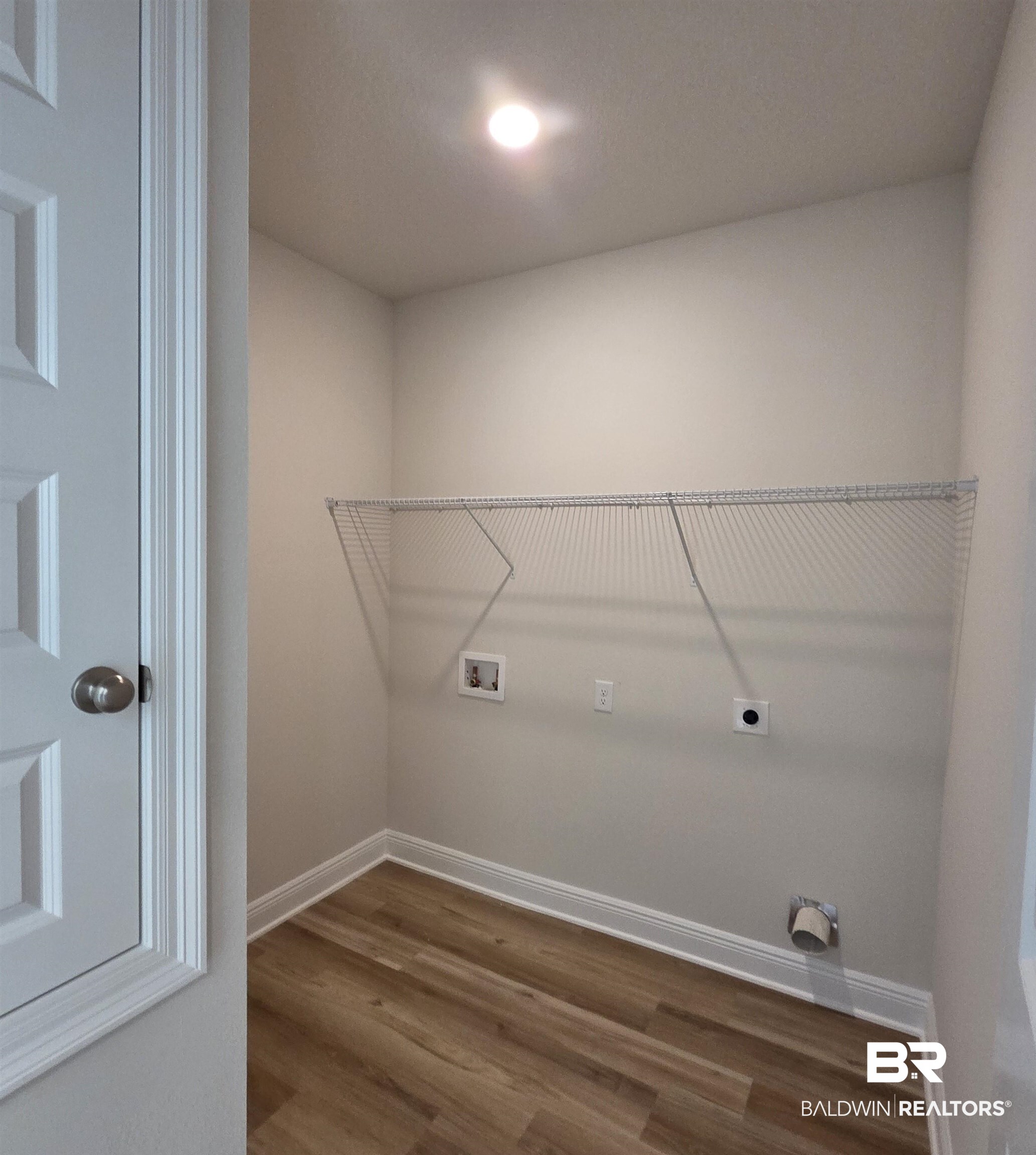 28133 Hallow Trail Elberta, AL 36530 - Photo 14 of 20 Washroom featuring washer hookup, wood finished floors, and hookup for an electric dryer
