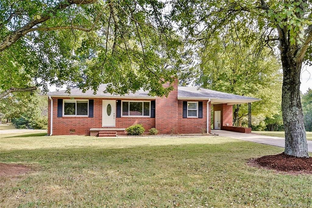 388 Shinnville Road Mooresville, NC 28115 - Photo 2 of 15 a front view of a house with a yard and trees