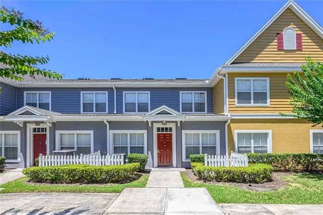 front view of a brick house with a large windows