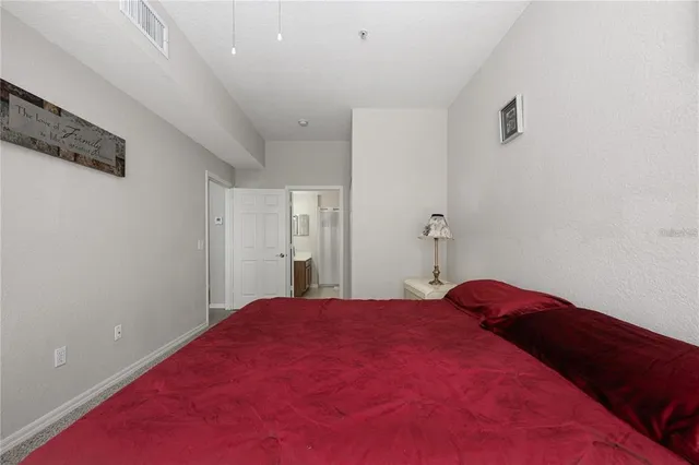 a bedroom with a bed and a closet