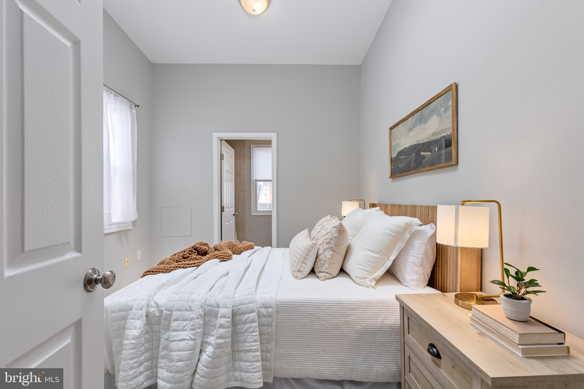 305 South Castle Street Baltimore, MD 21231 - Photo 9 of 28 a bedroom with a bed and a night stand