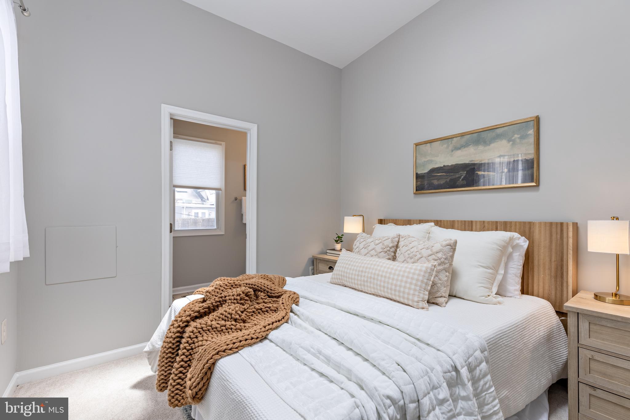 305 South Castle Street Baltimore, MD 21231 - Photo 12 of 28 a bedroom with a bed and a window