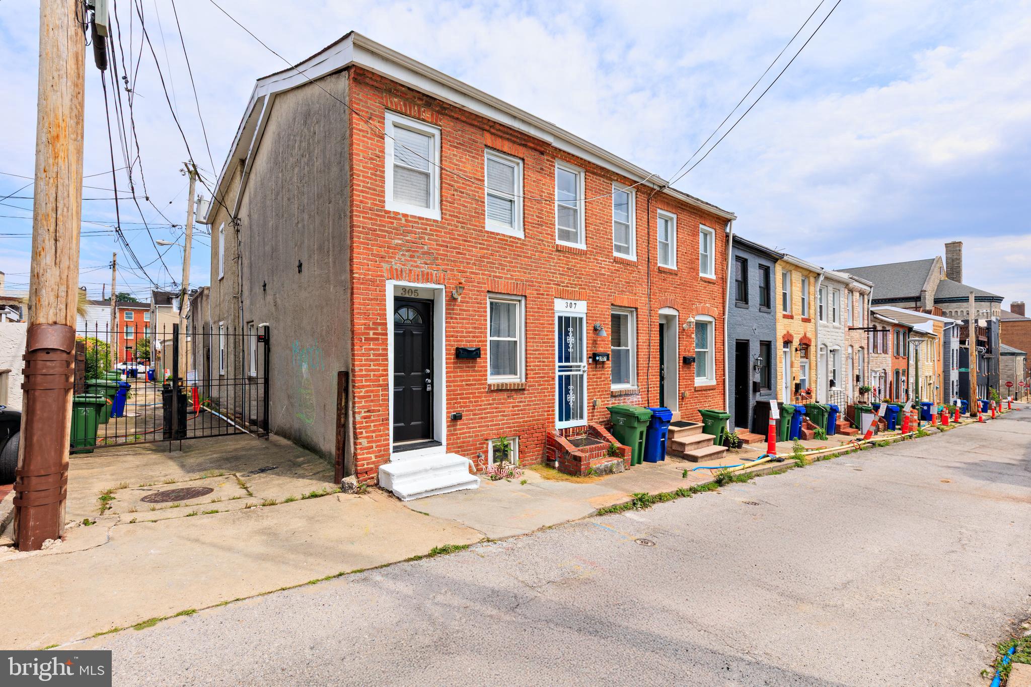 305 South Castle Street Baltimore, MD 21231 - Photo 2 of 28 a view of a building along the street