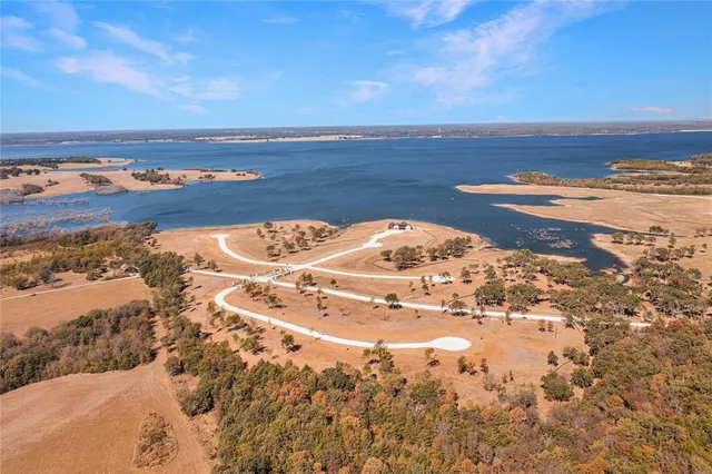 a view of a ocean with a building in the background