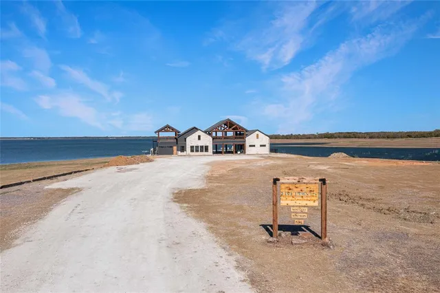 swimming pool view with a garden view