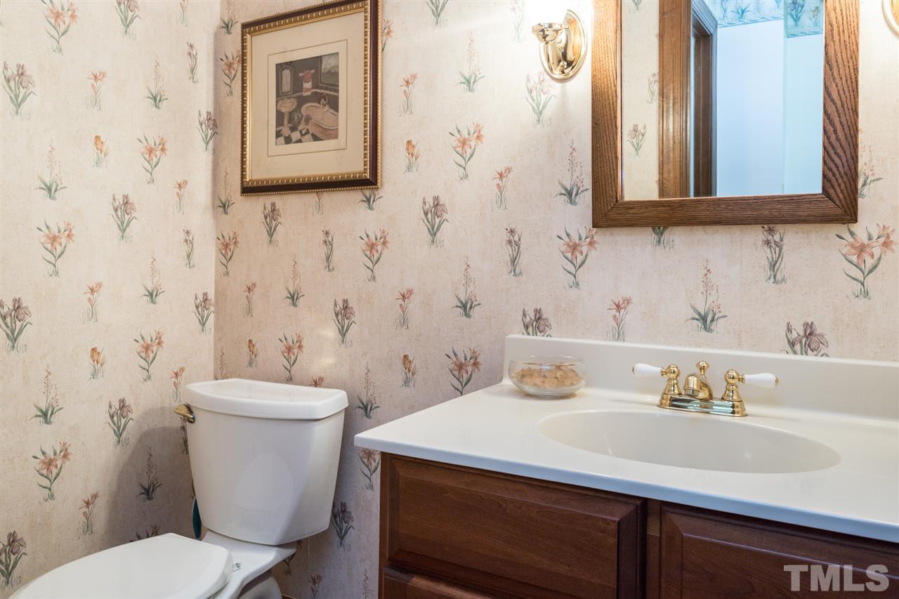 1812 Albacore Lane Raleigh, NC 27612 - Photo 13 of 30 a bathroom with a sink and a toilet