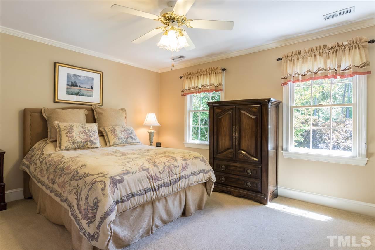 1812 Albacore Lane Raleigh, NC 27612 - Photo 23 of 30 a bedroom with a bed and a window