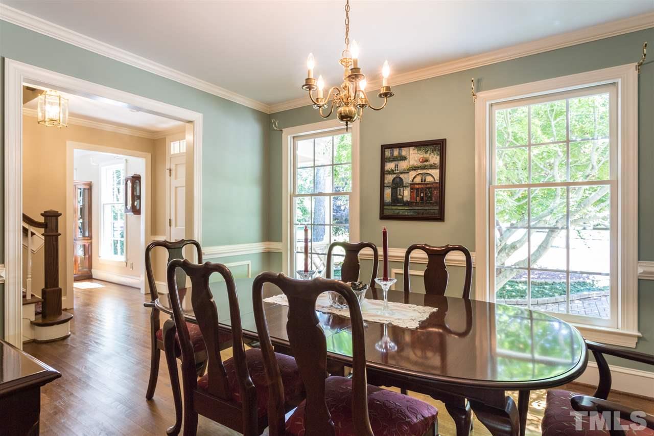 1812 Albacore Lane Raleigh, NC 27612 - Photo 5 of 30 a view of a a dining room with furniture window and wooden floor