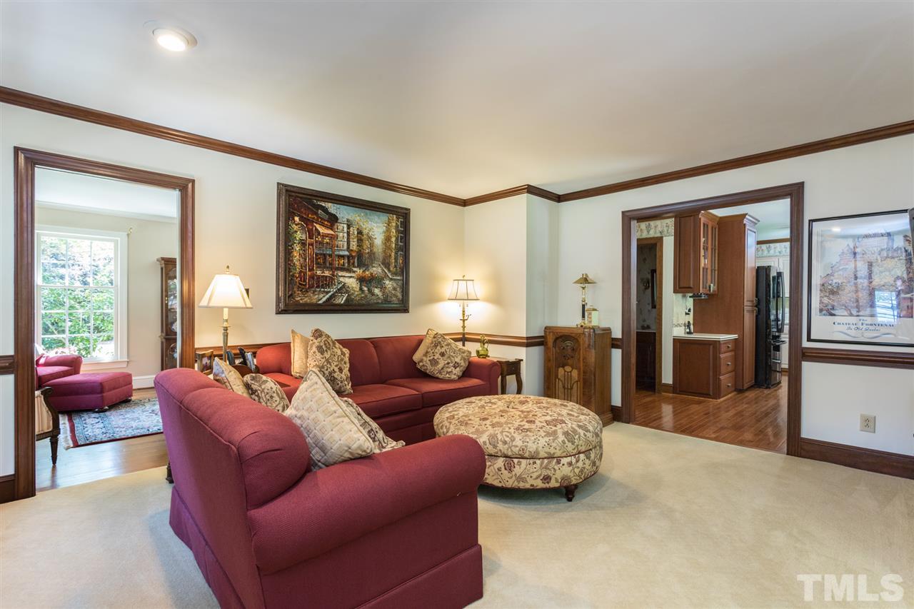 1812 Albacore Lane Raleigh, NC 27612 - Photo 6 of 30 a living room with furniture and a large window