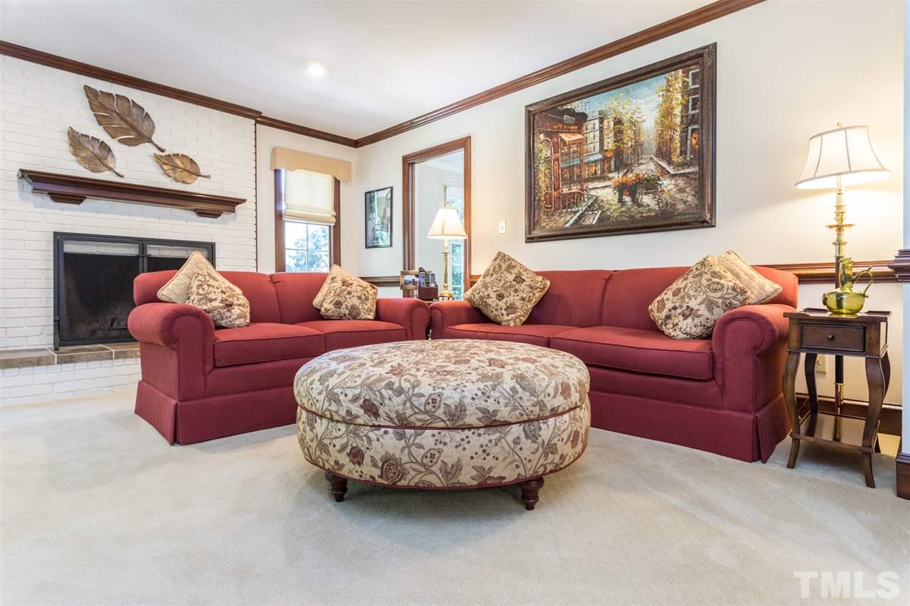 1812 Albacore Lane Raleigh, NC 27612 - Photo 7 of 30 a living room with furniture and a large window