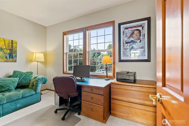 a spacious bedroom with a large bed and a large window