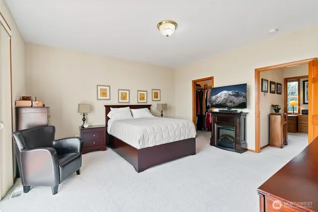 a bathroom with a sink double vanity granite and a mirror