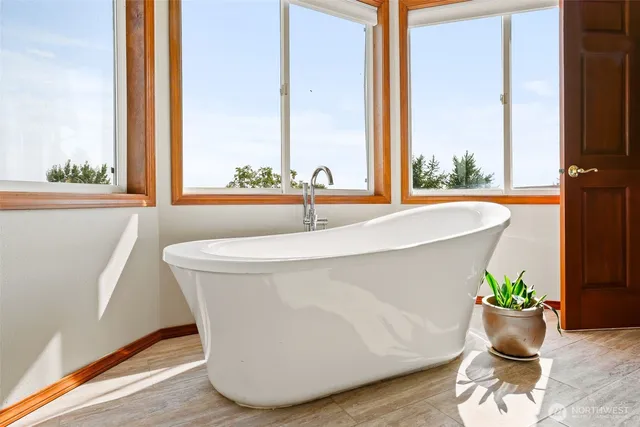 a bathroom with a glass shower door