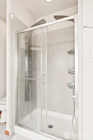a view of a balcony with wooden floor table and chairs