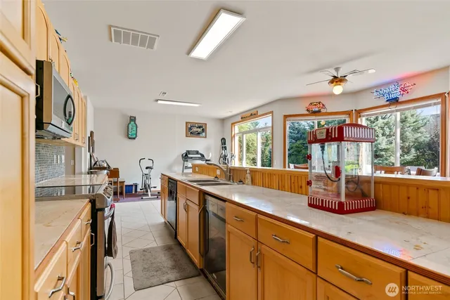 a bathroom with a sink vanity and a mirror