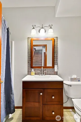 a view of a patio with table and chairs under an umbrella