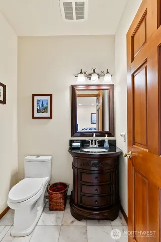 a bathroom with a toilet and a sink