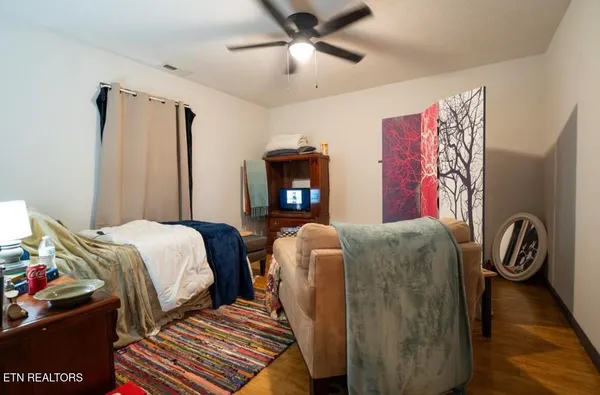 a bed room with two bed and a chandelier