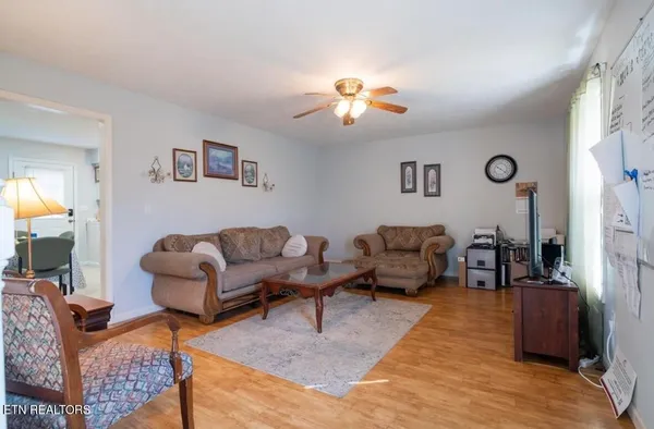 a living room with furniture or couch and a lamp