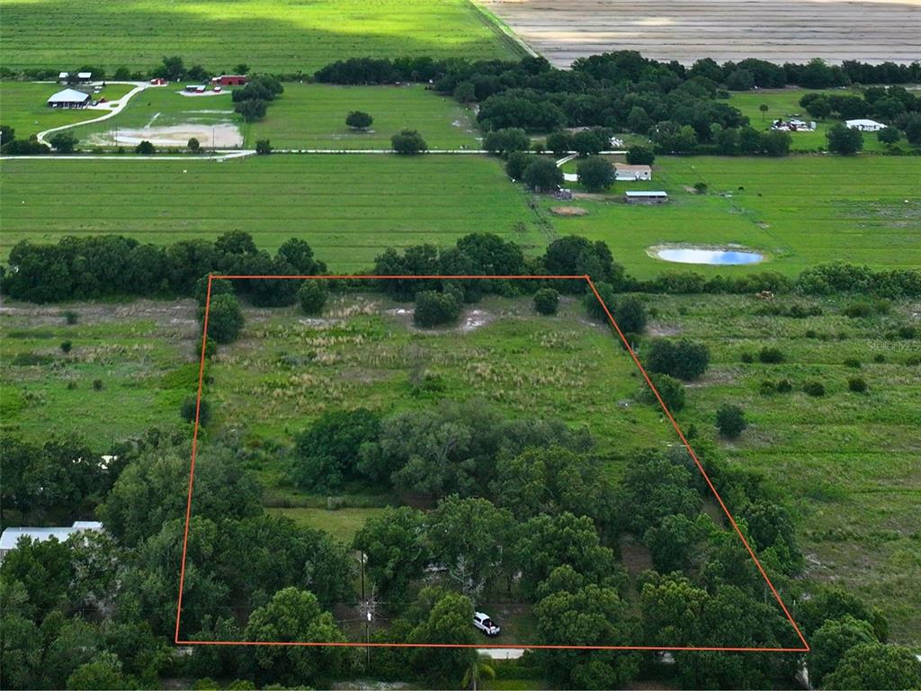 9827 Southeast Hoth Road Arcadia, FL 34266 - Photo 6 of 28 a lush green field with lots of green space