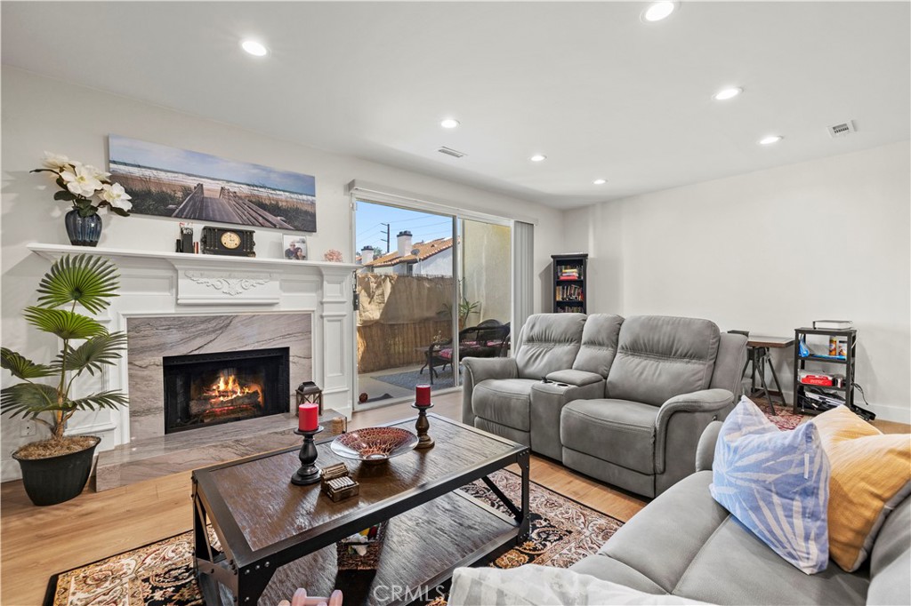 5602 Las Virgenes Road, Unit 79 Calabasas, CA 91302 - Photo 14 of 56 a living room with furniture and a fireplace