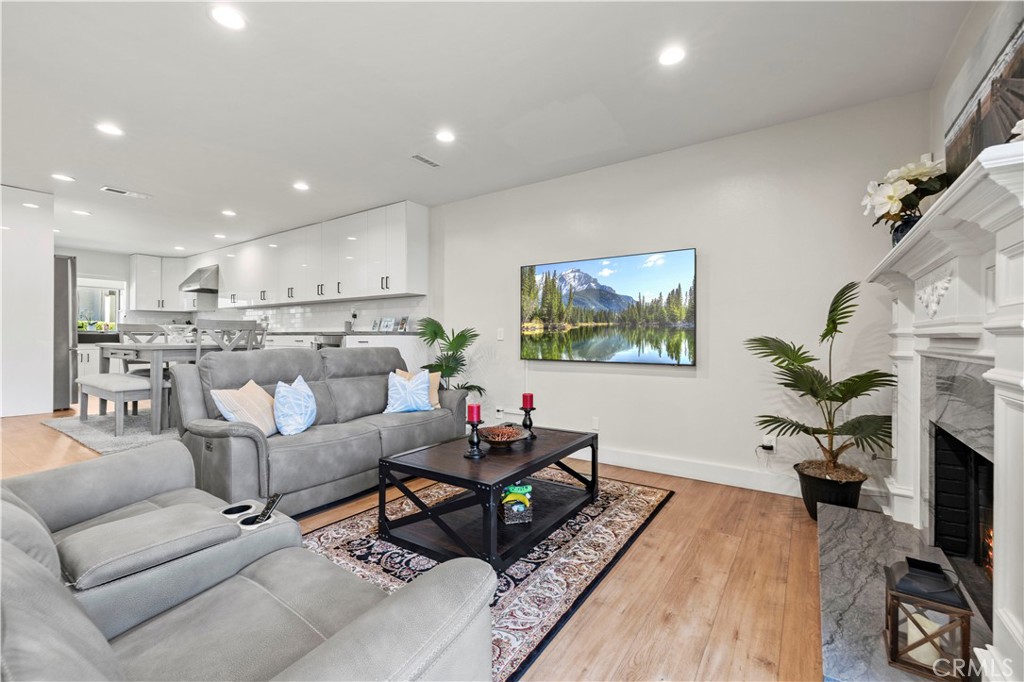 5602 Las Virgenes Road, Unit 79 Calabasas, CA 91302 - Photo 16 of 56 a living room with furniture and a potted plant