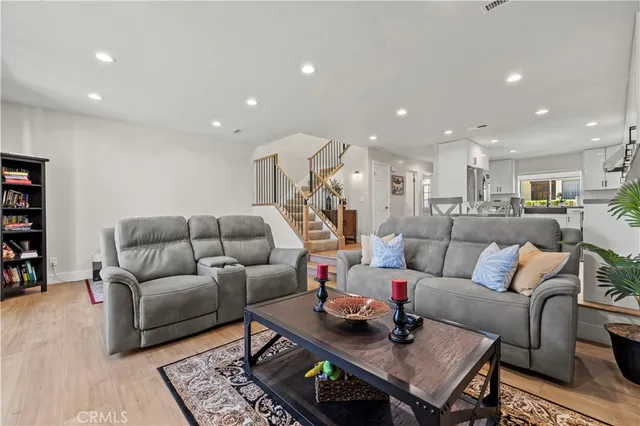 a living room with furniture and a rug