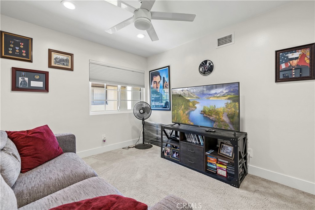 5602 Las Virgenes Road, Unit 79 Calabasas, CA 91302 - Photo 22 of 56 a living room with furniture and a flat screen tv