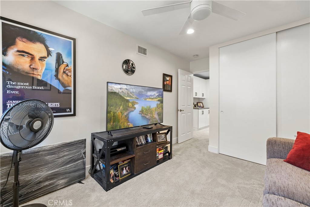 5602 Las Virgenes Road, Unit 79 Calabasas, CA 91302 - Photo 23 of 56 a living room with furniture and a flat screen tv