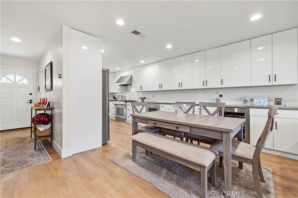 5602 Las Virgenes Road, Unit 79 Calabasas, CA 91302 - Photo 4 of 56 a open kitchen with stainless steel appliances granite countertop a stove and a refrigerator