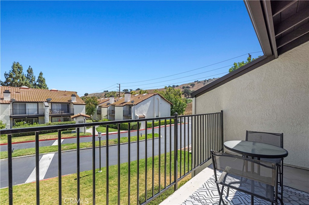 5602 Las Virgenes Road, Unit 79 Calabasas, CA 91302 - Photo 42 of 56 a view of a balcony with an outdoor seating