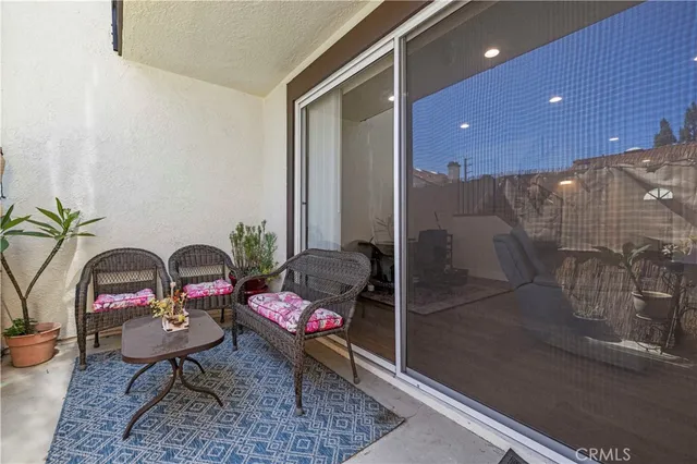 an aerial view of a house with garden space and street view