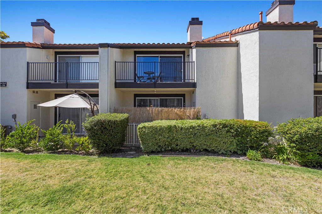 5602 Las Virgenes Road, Unit 79 Calabasas, CA 91302 - Photo 45 of 56 a front view of a house with garden