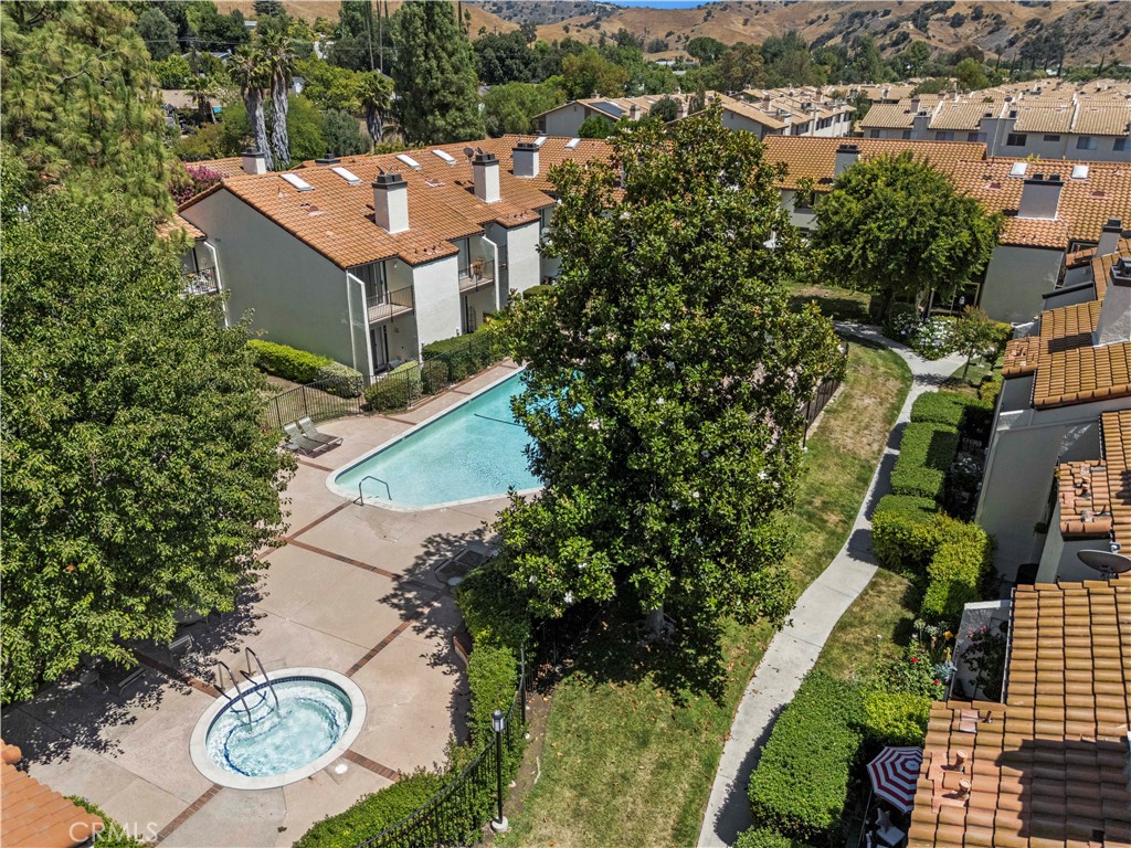 5602 Las Virgenes Road, Unit 79 Calabasas, CA 91302 - Photo 48 of 56 an aerial view of a house with garden space and street view