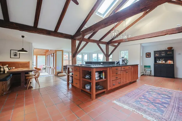 a view of an entryway with wooden floor and windows