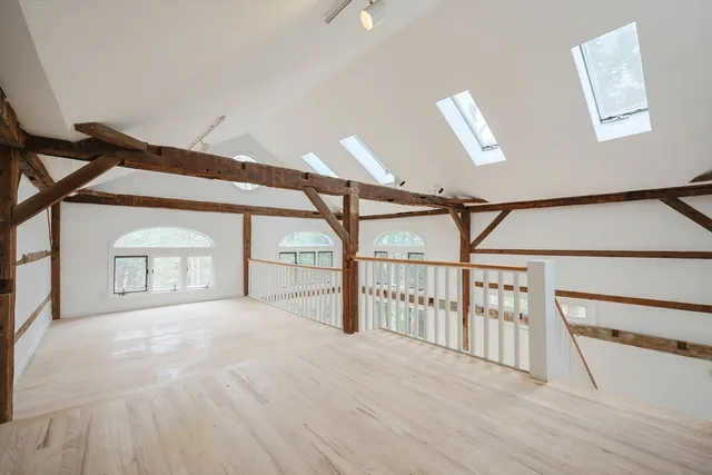 an aerial view of a house with a yard and garden