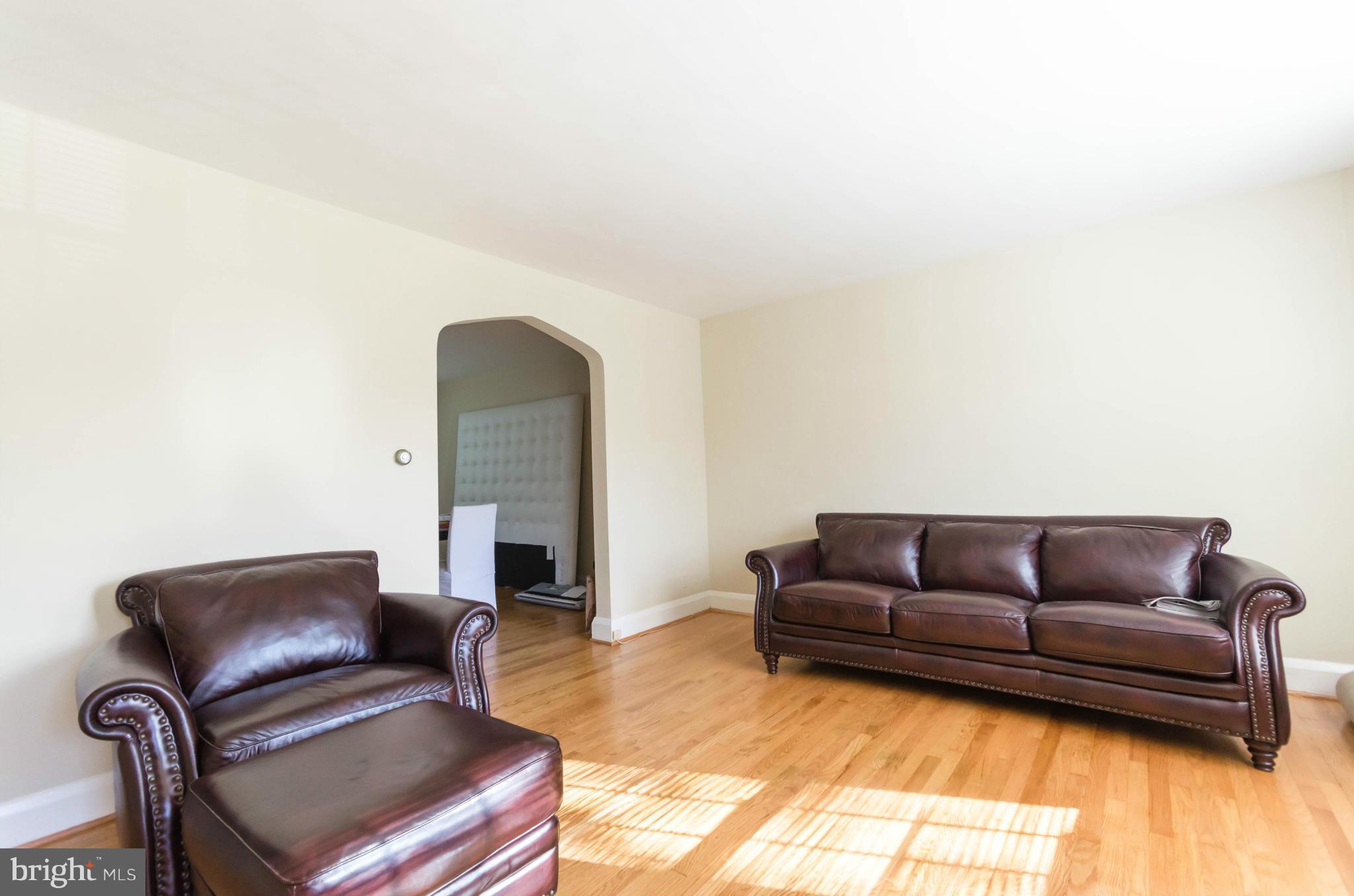 10 Murdock Road Baltimore, MD 21212 - Photo 2 of 26 a living room with a couch and a fireplace