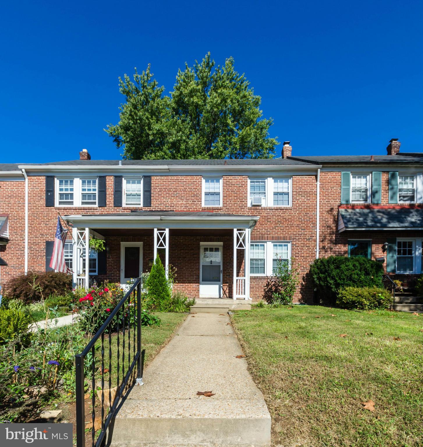 10 Murdock Road Baltimore, MD 21212 - Photo 20 of 26 a front view of a house with a yard and potted plants