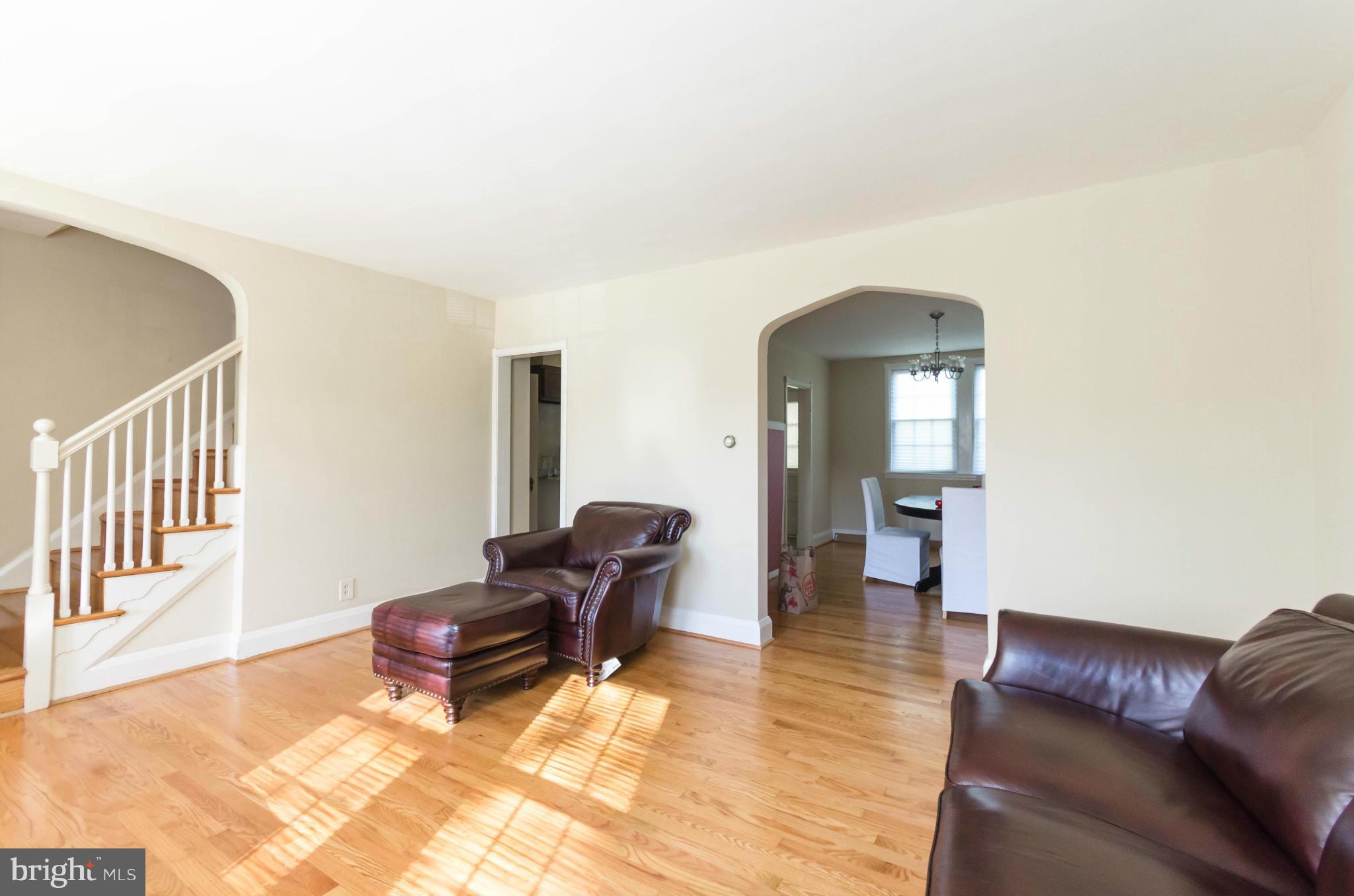 10 Murdock Road Baltimore, MD 21212 - Photo 3 of 26 a living room with furniture and a dining table