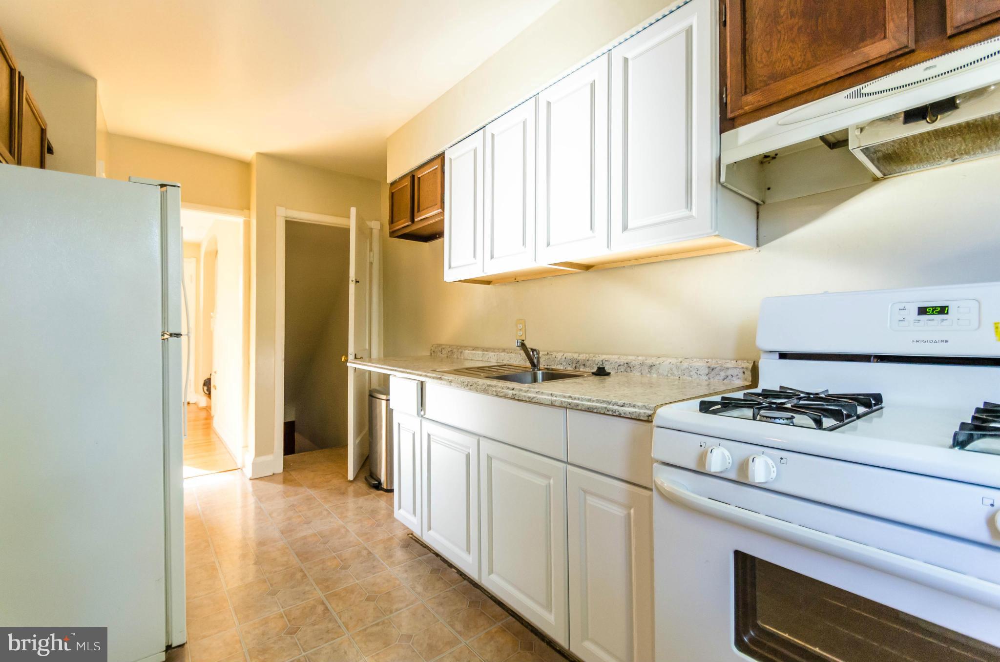 10 Murdock Road Baltimore, MD 21212 - Photo 5 of 26 a kitchen with stainless steel appliances granite countertop a stove and a refrigerator