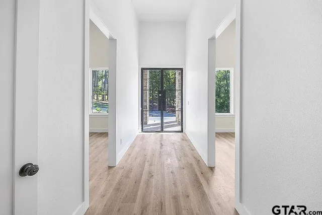 wooden floor in a room next to a window