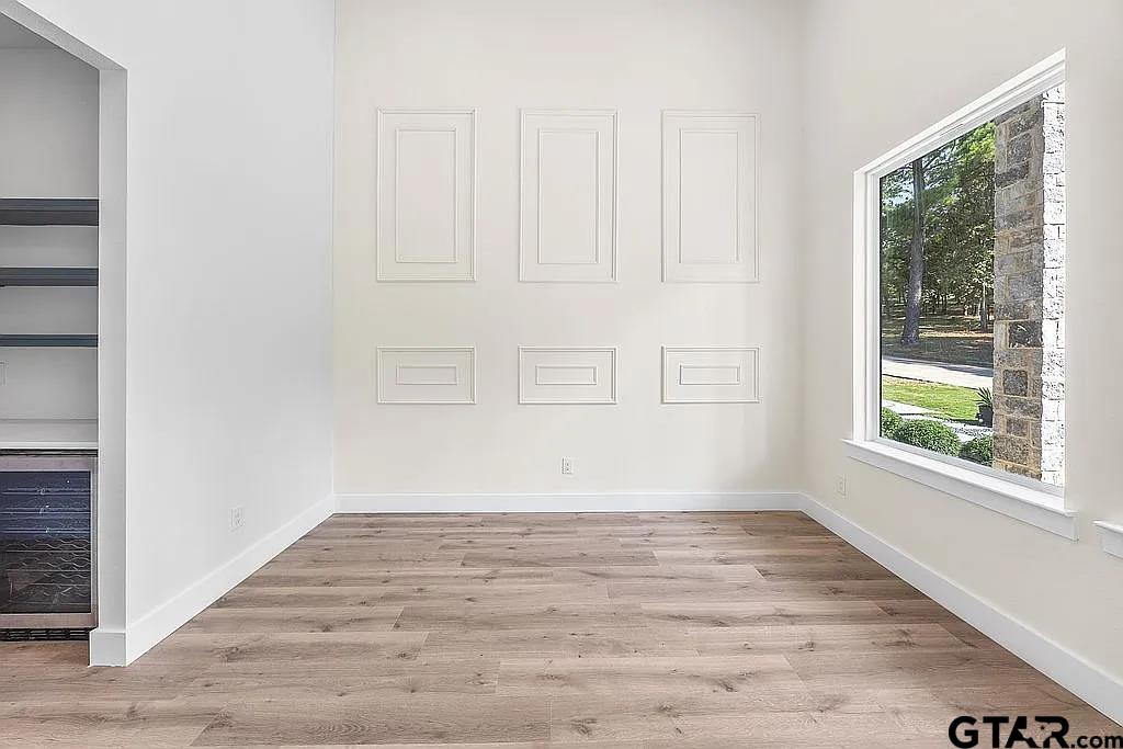 4504 Triggs Trace Tyler, TX 75709 - Photo 20 of 46 an empty room with wooden floor and windows