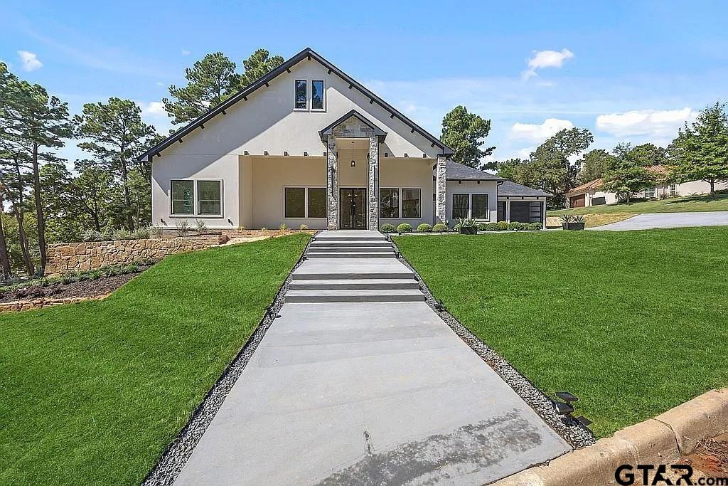 4504 Triggs Trace Tyler, TX 75709 - Photo 2 of 46 a front view of a house with a yard
