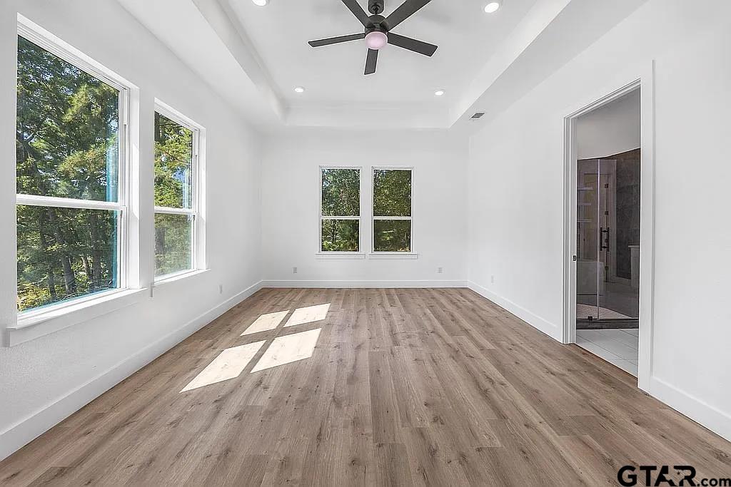 4504 Triggs Trace Tyler, TX 75709 - Photo 27 of 46 a view of empty room with wooden floor and fan