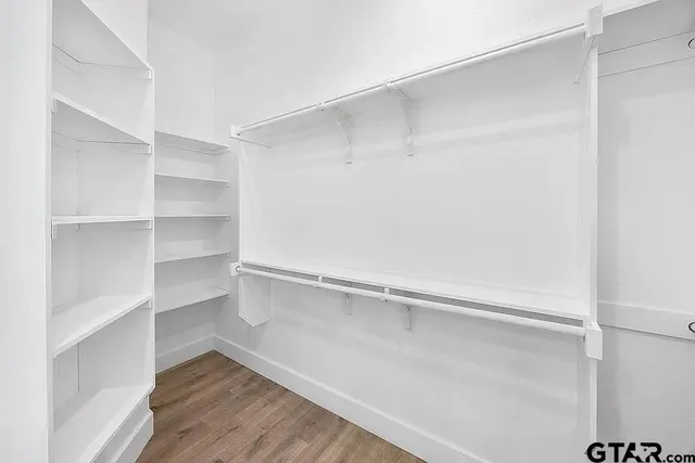a view of an empty walk in closet